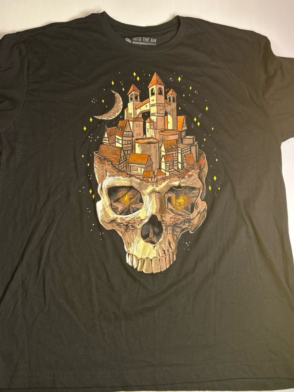 Into The AM Black Graphic Tee with castle skull print